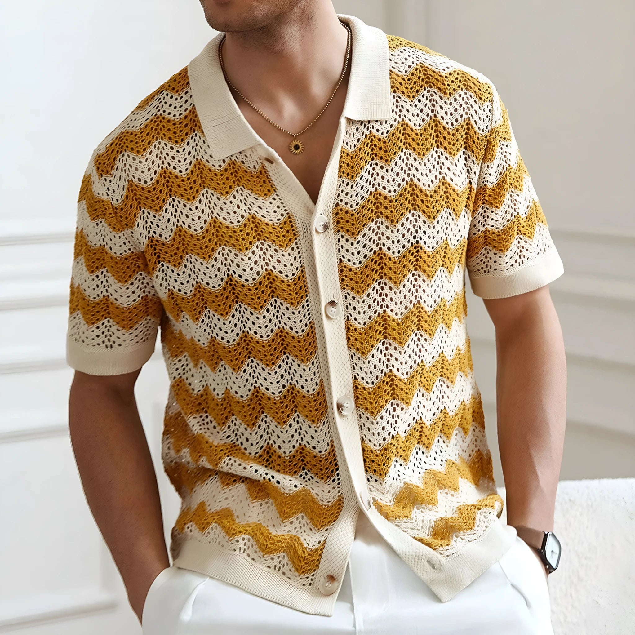 Man wearing a blue short-sleeve corrugated knit sweater with a hollow jacquard pattern, showcasing texture.
