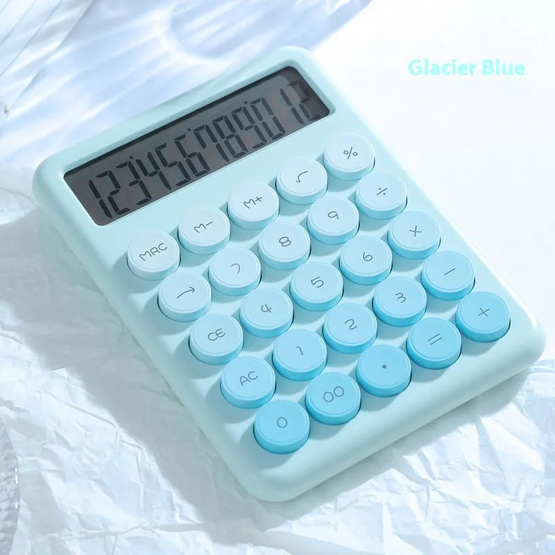 Gradient colour desktop calculator in violet, pink, blue, or green on a desk.
