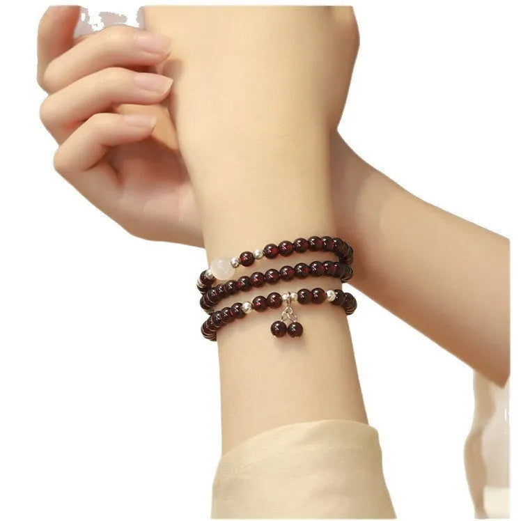 Antique style Chinese bracelet with U-shaped design and floral red garnet imitation gemstones