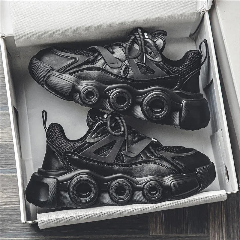 Men's low-top casual sneakers in black with a mesh upper, thick rubber sole, and round toe.