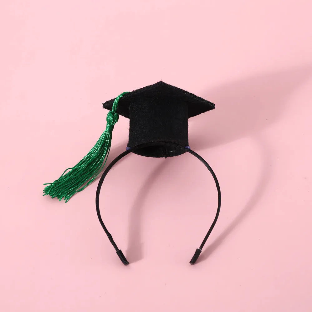 British-style pet hair band and bow tie set in four colour options on a mannequin head.
