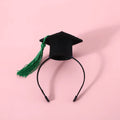 British-style pet hair band and bow tie set in four colour options on a mannequin head.