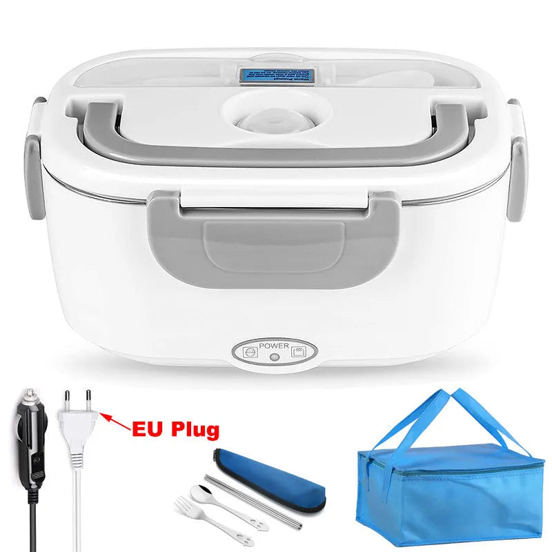 Grey dual voltage electric lunch box with plastic body shown next to a car socket and mains plug