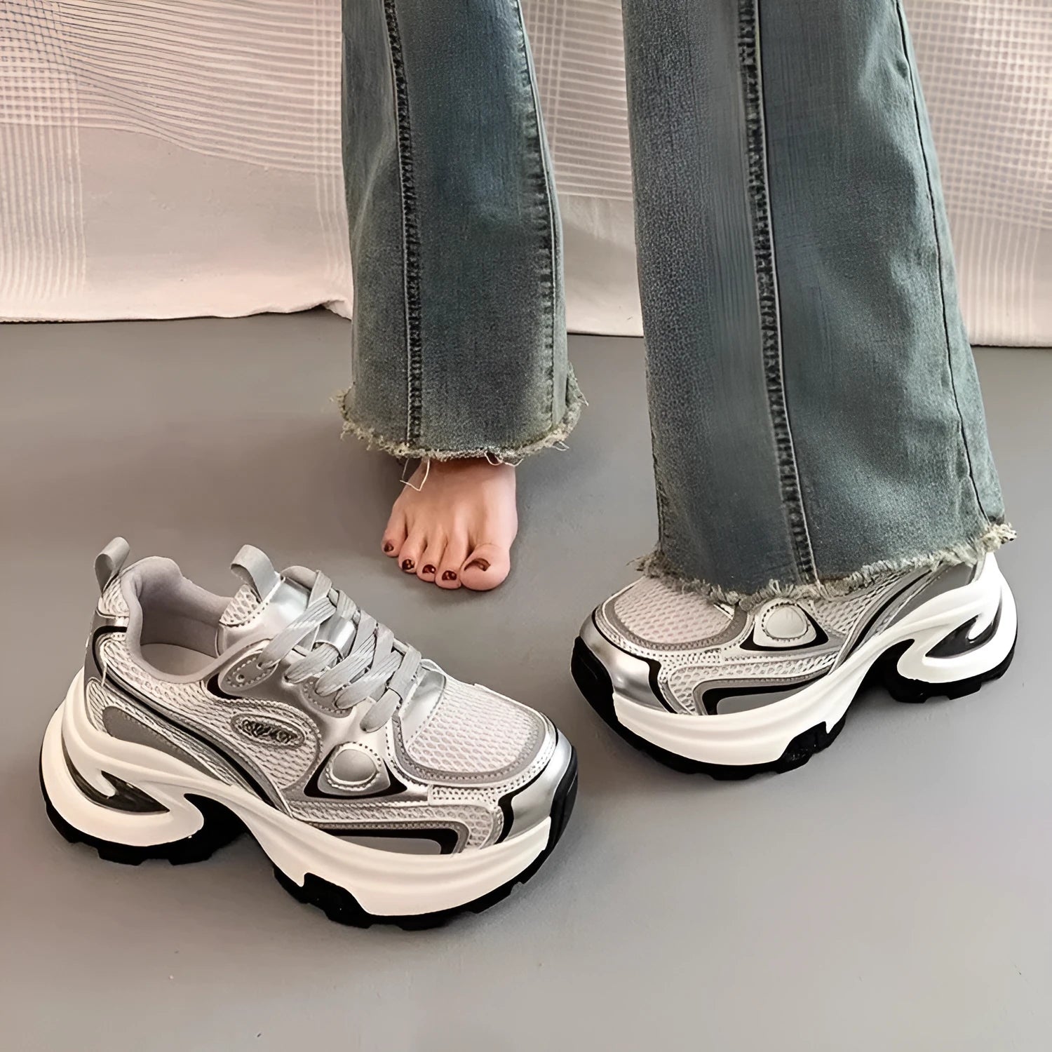 Women's silver and red mesh platform sneakers with a rubber sole and lace-up design
