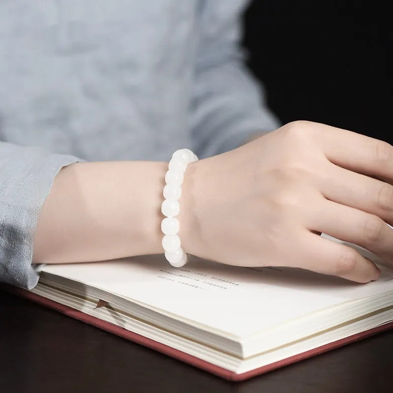 White Hetian jade barrel bead bracelet for men and women showing bead size options.