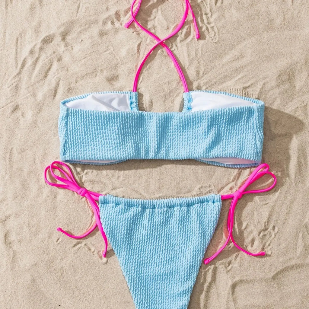 Women's solid colour halter neck lace-up separated two-piece swimsuit on a model.