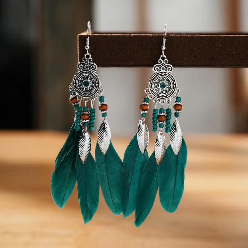 Bohemian style round drop feather earrings with leaf design in alloy, showing electroplated finish.