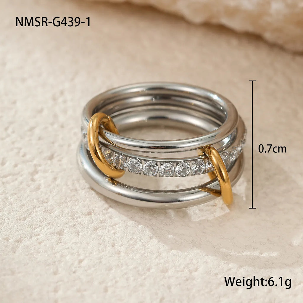 A stacked stainless steel ring set with 18K gold plating in an exaggerated design for women.