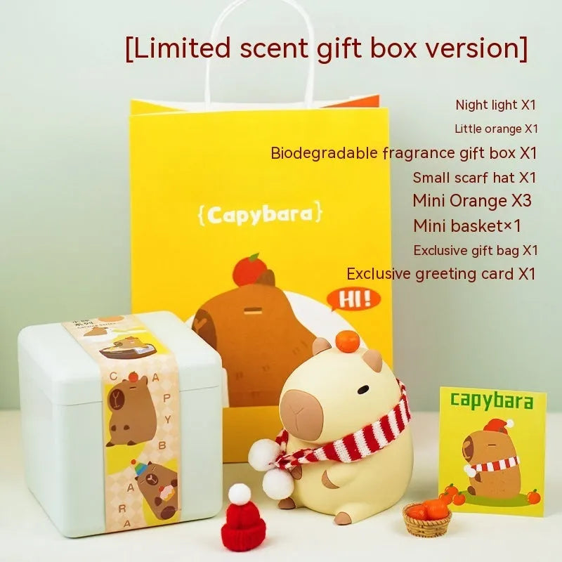 Small capybara-shaped night lamp in silicone and plastic, shown with USB cable.
