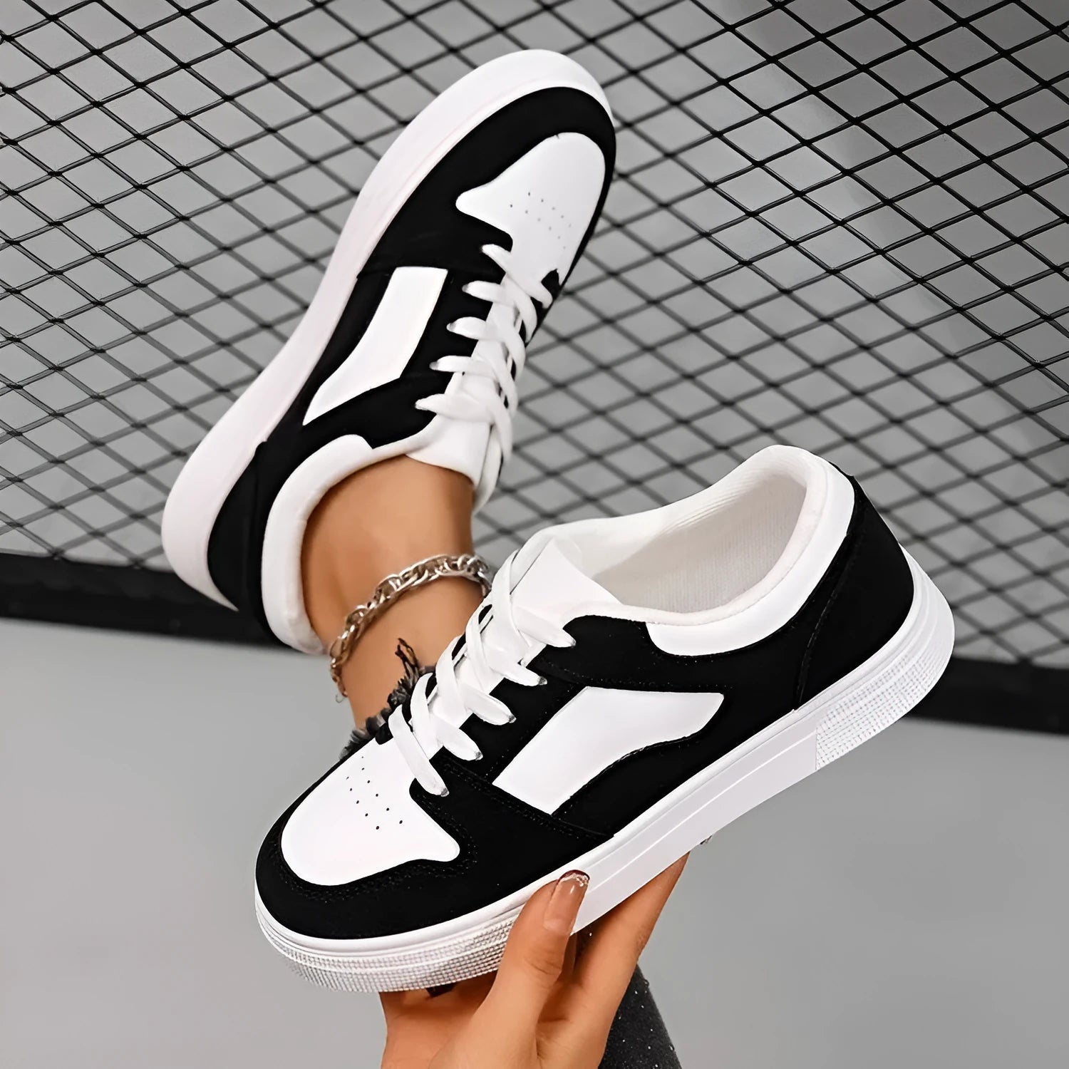 Black women's casual sports shoes with flat rubber sole and lace-up front