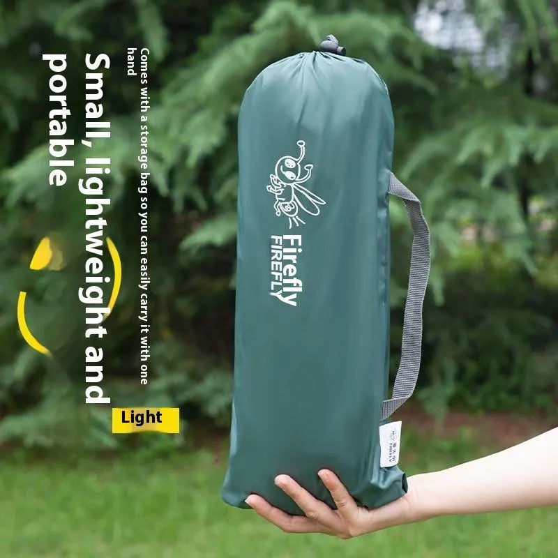 Single person manual camping tent unfolded showing interior space, with optional ground pad.