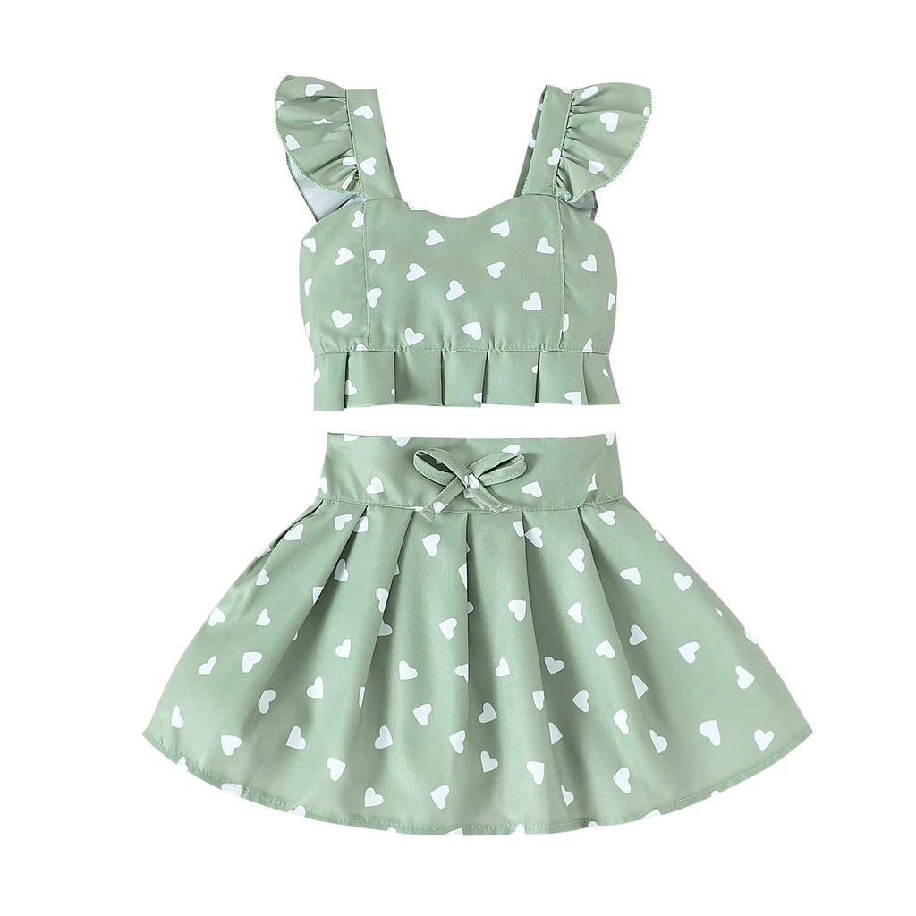 Girls' cotton two-piece skirt set with long-sleeve flounced top, bow, and pleated skirt in green or white