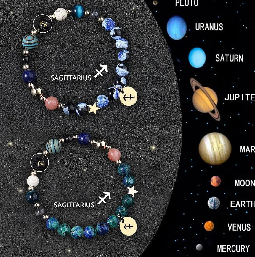 Two natural stone beaded bracelets with sterling silver zodiac charms on a wooden surface.
