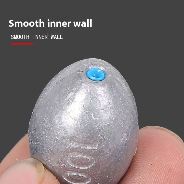 Scaled olive lead fishing sinker with Tongxin plastic core in rugby shape.