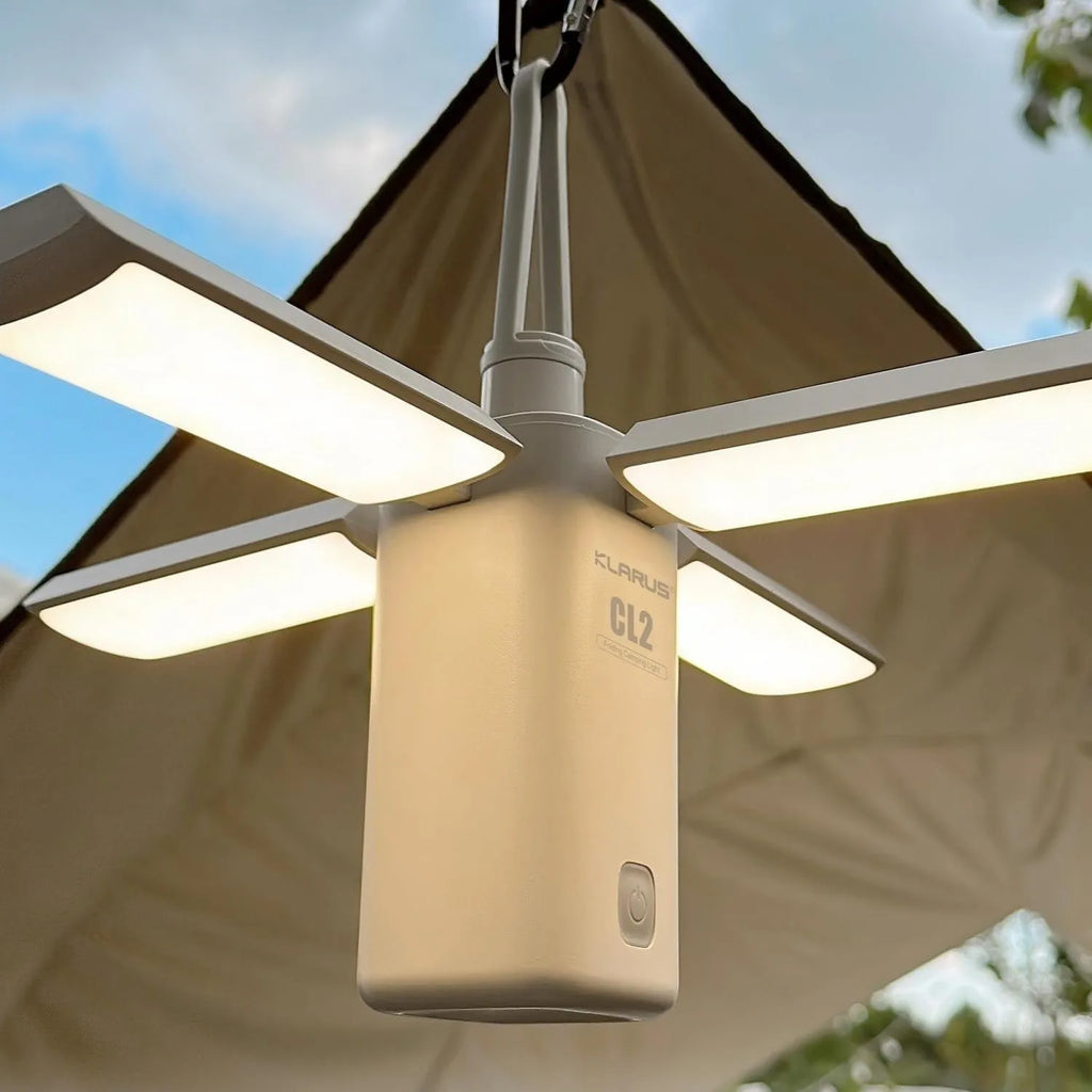 Green and white outdoor LED campsite lamp with USB charging cable and manual