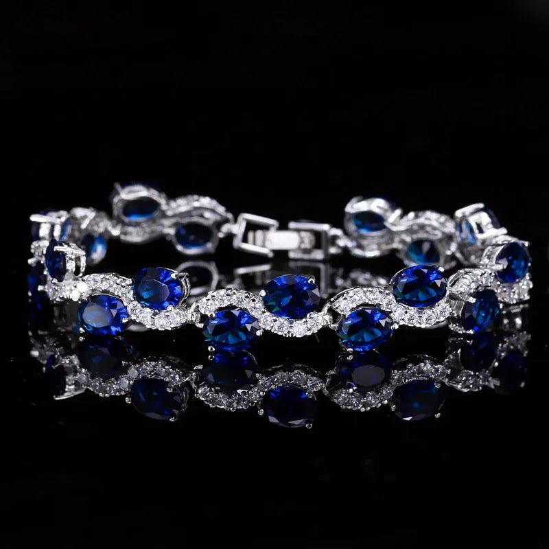 Copper-plated gold bracelet with AAA zircon stones on a wrist, showing geometry design.