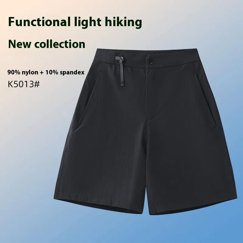 Man wearing khaki 3D cut athletic shorts with four-way stretch, suitable for running or climbing.