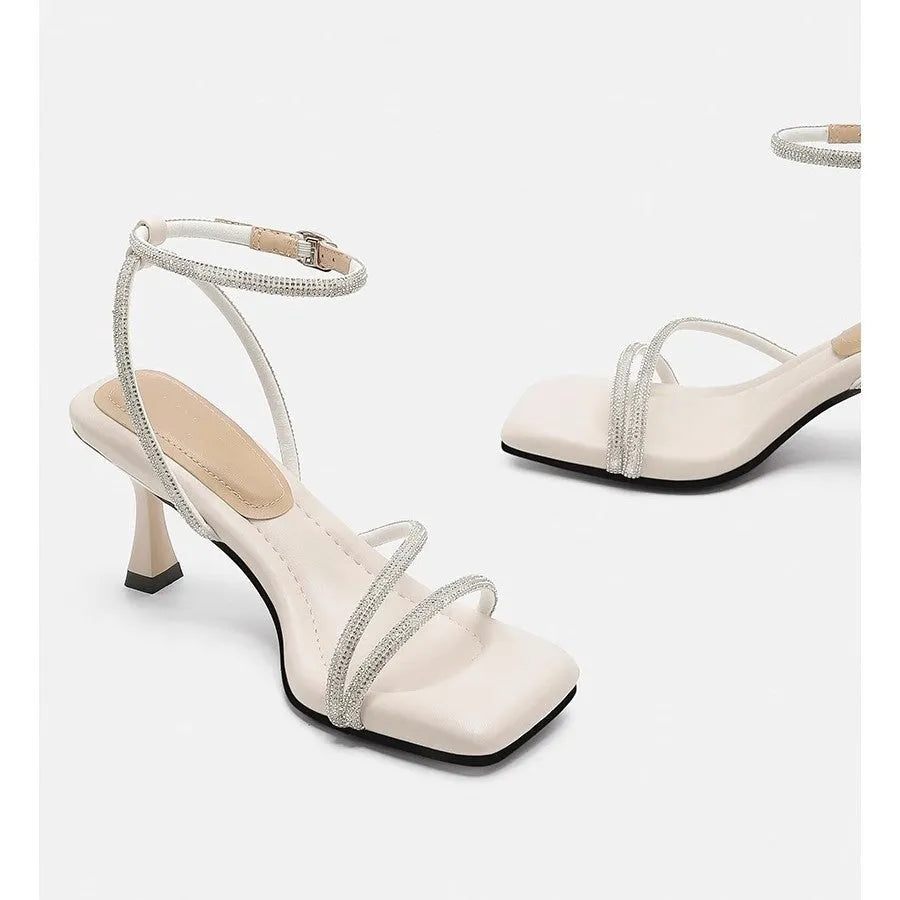 Women's silver rhinestone square-toe sandals with an ankle-strap buckle.