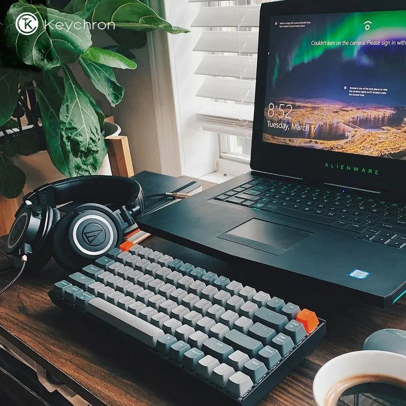Plastic edge 87-key mechanical keyboard with white LED backlighting, grey colour, showing keycaps and USB cable