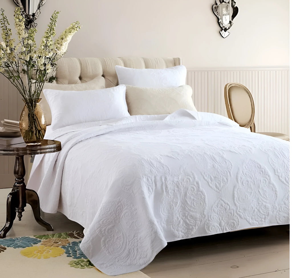 Three-piece pure cotton quilted bed cover set in white with Nordic floral embroidery on a 1.8m bed