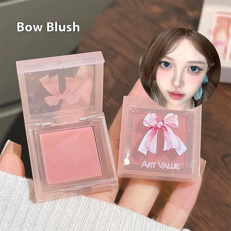 Butterfly Box makeup set showing pink lip mud, powder blusher, and necklace