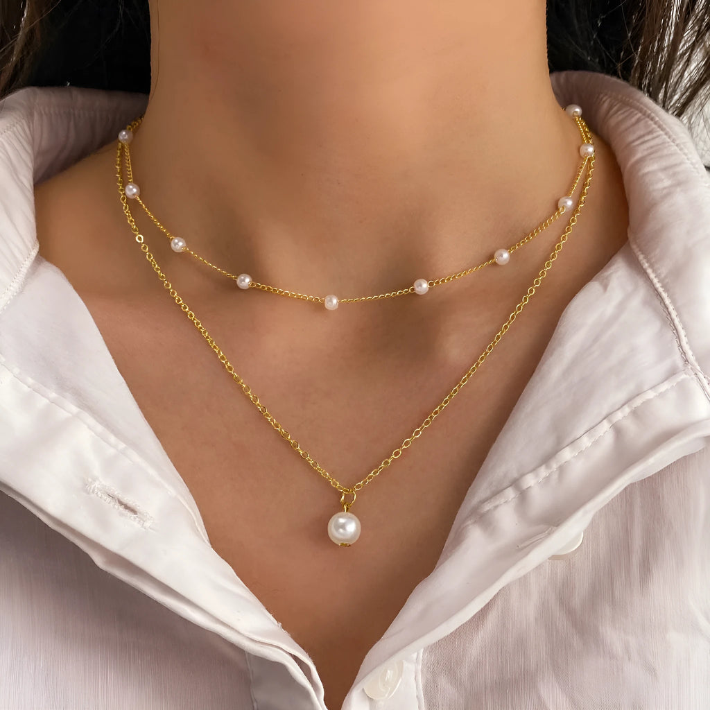 Women's gold pearl tassel pendant double-layer necklace set with alloy O-ring chain on display showing three colour variants