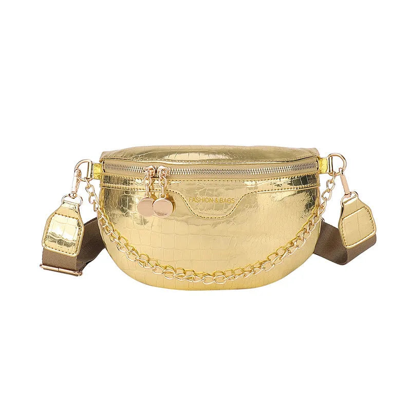 Shiny hard-shell PU chest bag with wide shoulder strap, chain detail, and internal pockets in silver colour