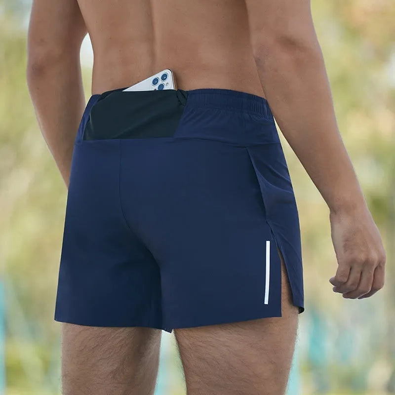 Man wearing navy blue high-waist off-road running shorts with a loose, breathable cut during a run.