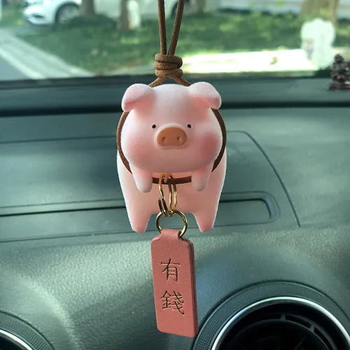 A hard resin cartoon pig car dashboard ornament in one of eight available decorative styles.