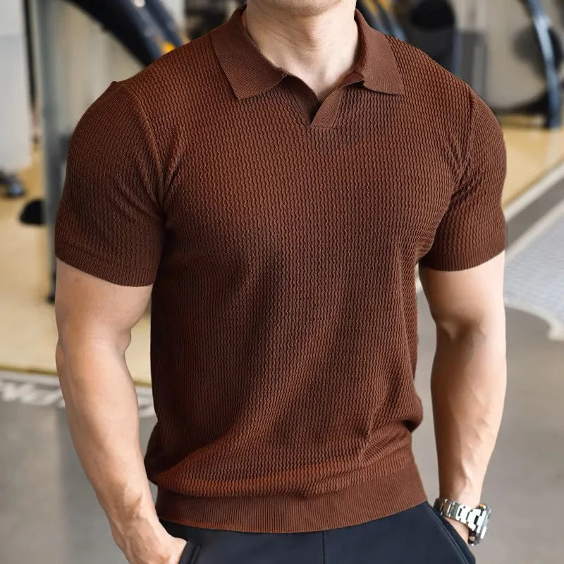 Men's slim fit polo shirt with button-down Henry collar in lightweight polyester fabric.