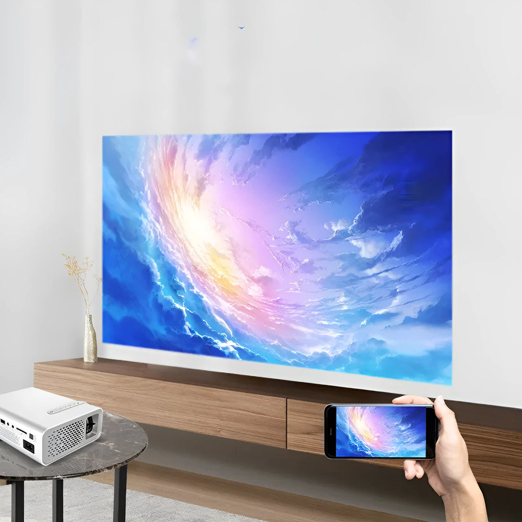 Black YG530 mini mobile phone projector on table projecting image on wall