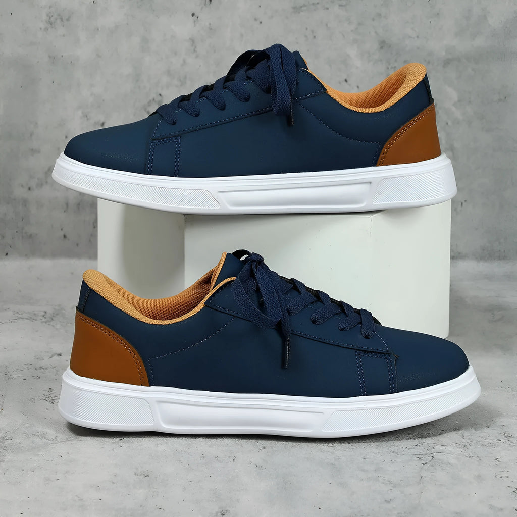 Beige brown platform skateboard sneakers with a cross-strap and round toe on a white background.