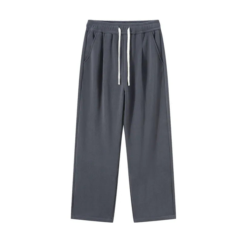 Men's apricot coloured loose-fit polar fleece winter sports pants with a drawstring waist.
