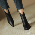 Women's solid colour ankle boots in black with pigskin split leather upper, mid heel, pointed toe, and back zipper.