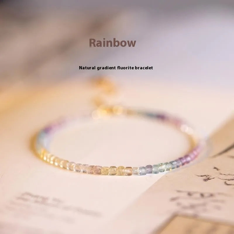Handmade women's bracelet with geometric copper links and rainbow fluorite decoration