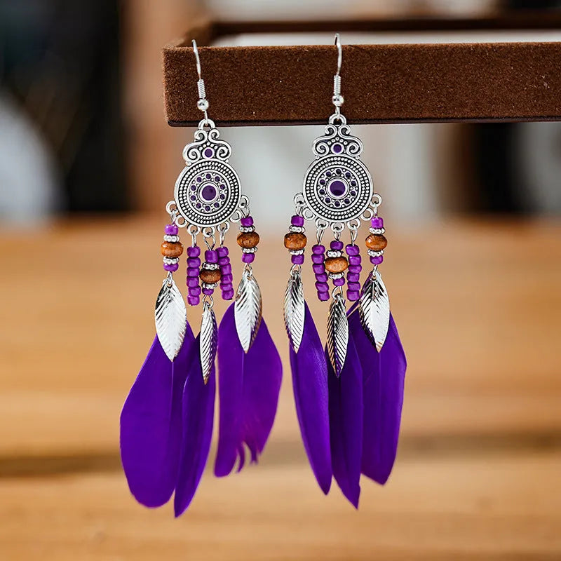 Bohemian style round drop feather earrings with leaf design in alloy, showing electroplated finish.