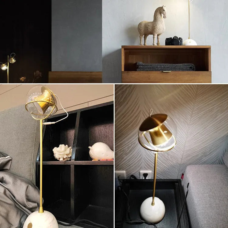 Glass lampshade desk lamp with touch dimming control on wooden surface