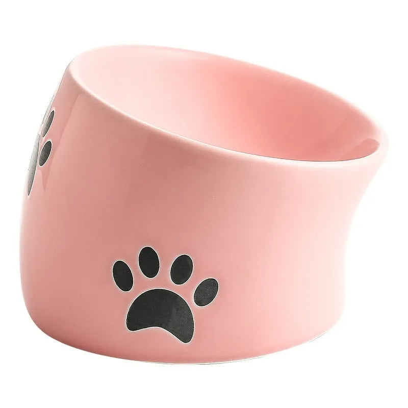 Ceramic cat bowl with cat paw design in black, showing oblique mouth style.