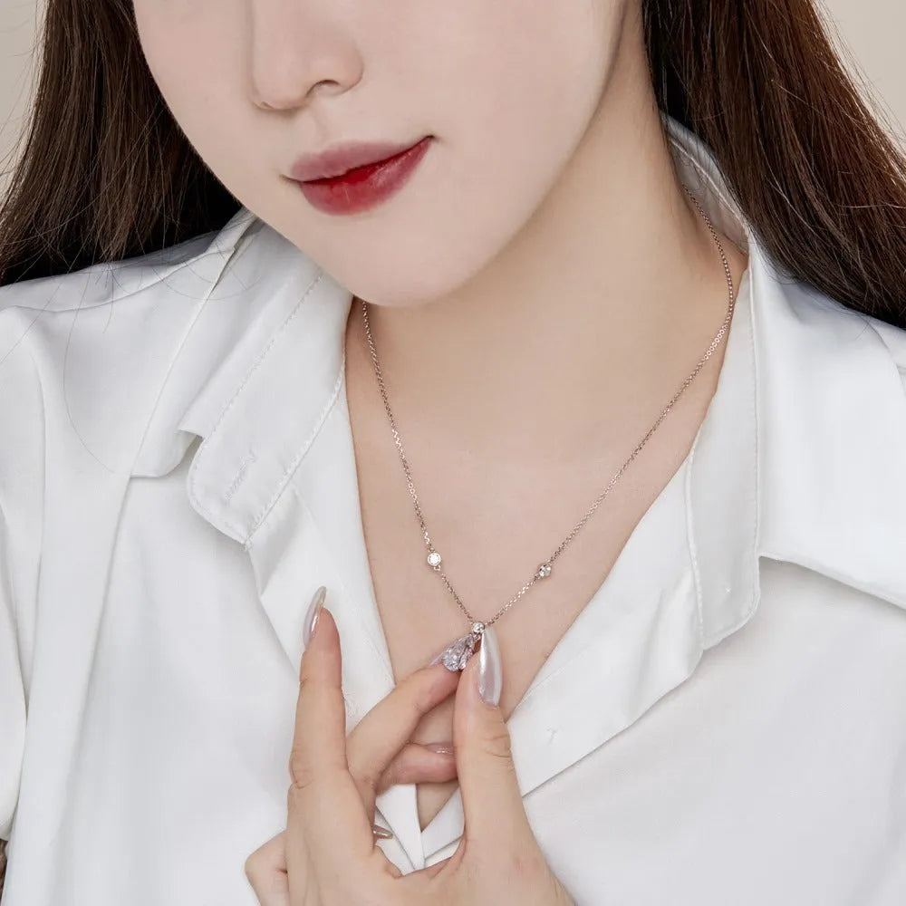 925 silver drop-shaped necklace with electroplated platinum white diamond finish on display