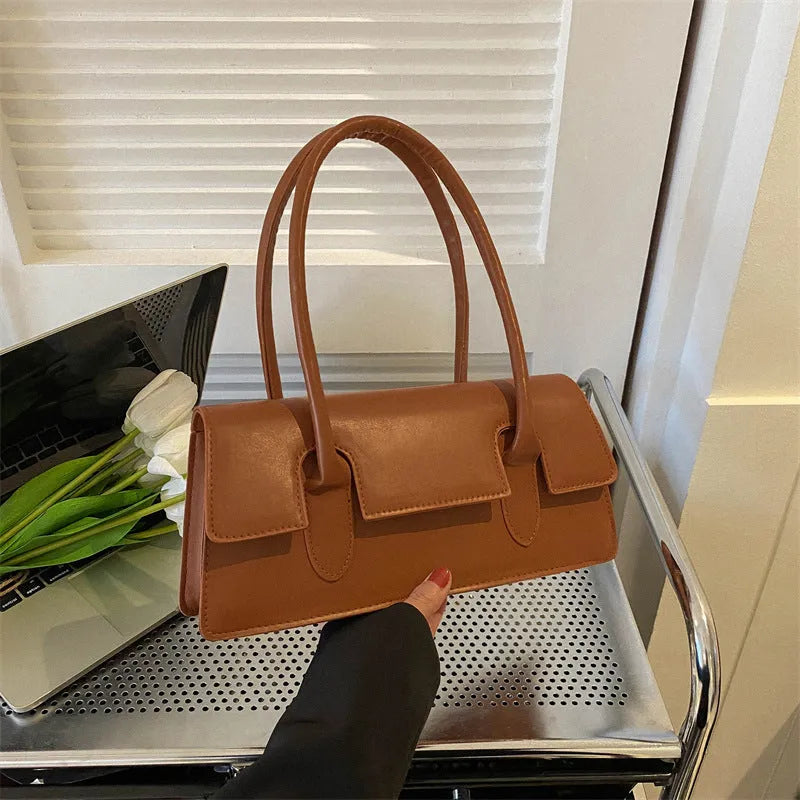 Women's small square shoulder bag in PU leather showing horizontal design with stitching details