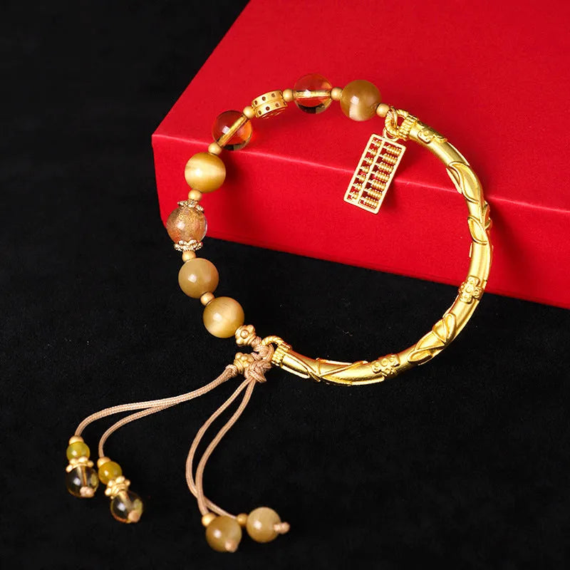 Tiger eye and citrine beaded bracelet with yellow crystal and diamond-shaped copper parts for women