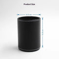 Small round black leather pen container for desk organisation.