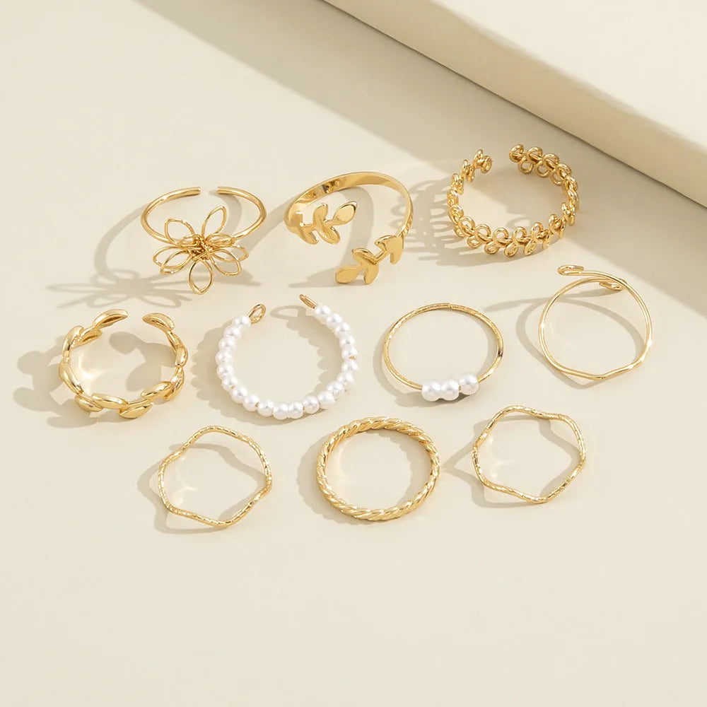 Gold colour openwork flower ring for women with glossy electroplated finish