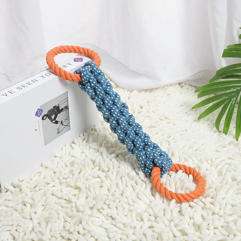 Blue braided cotton rope dog toy shaped like a bone with two rings, on a white background.