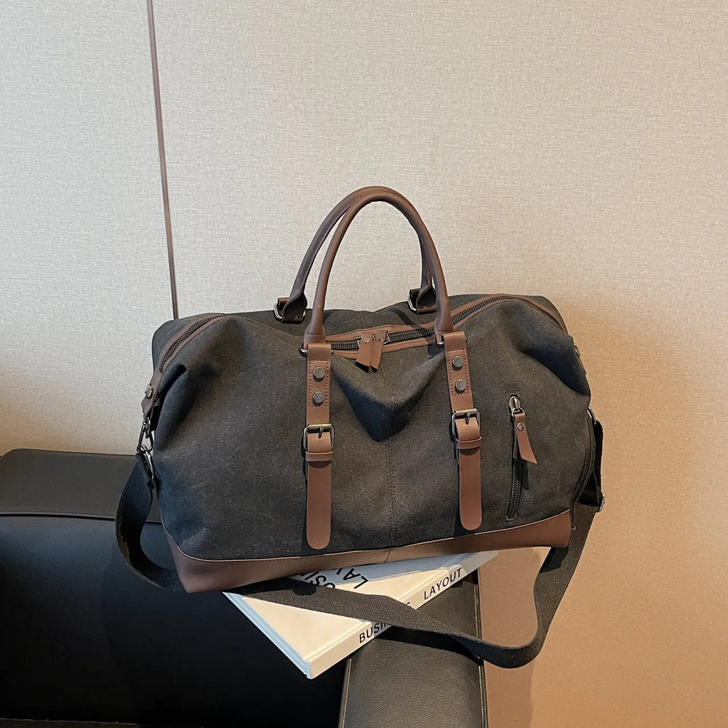 Canvas travel shoulder bag in solid green colour for leisure use