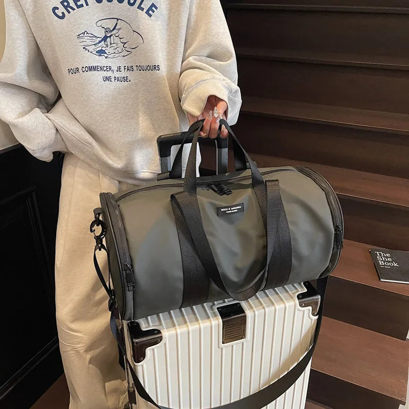 Black waterproof Oxford cloth sports handbag for men and women on a leisure travel background.