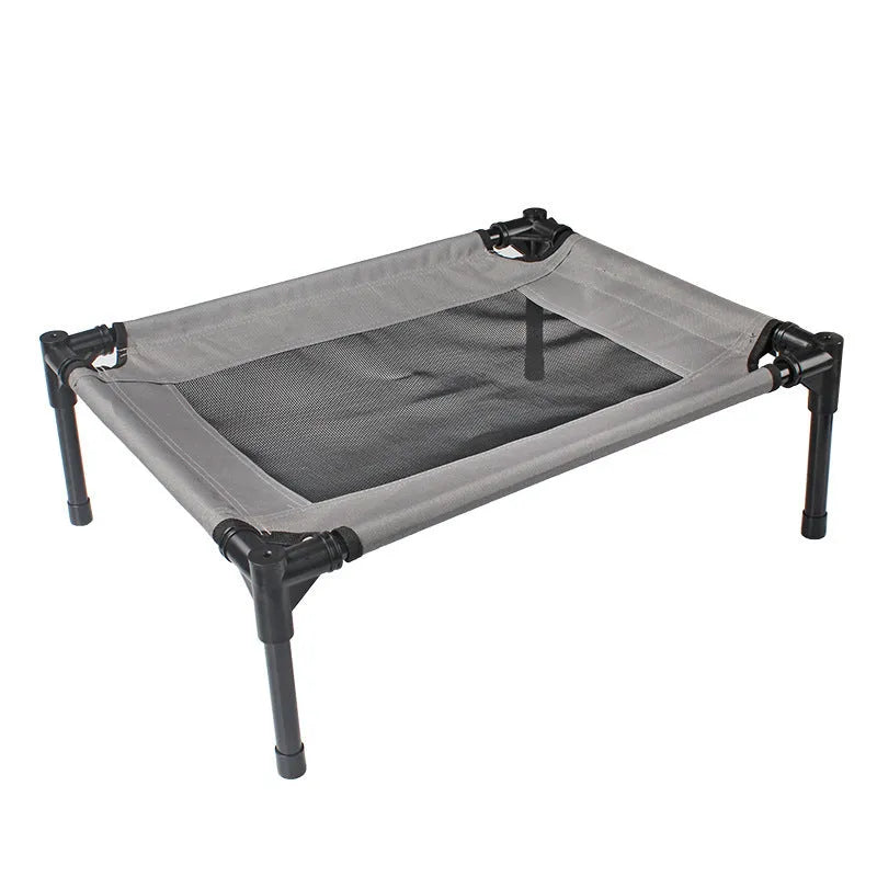 Black portable outdoor dog bed with removable washable cover and steel frame, shown on grass.
