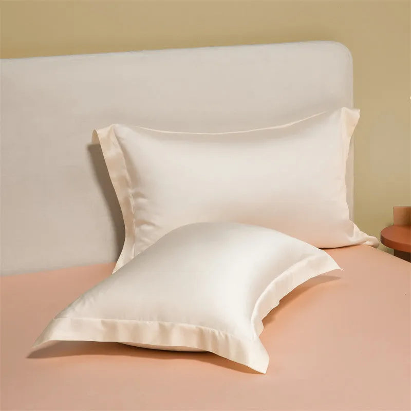 Aurora Blue 200 thread count Tencel duvet cover, fitted sheet, and pillowcases laid on a modern bed.