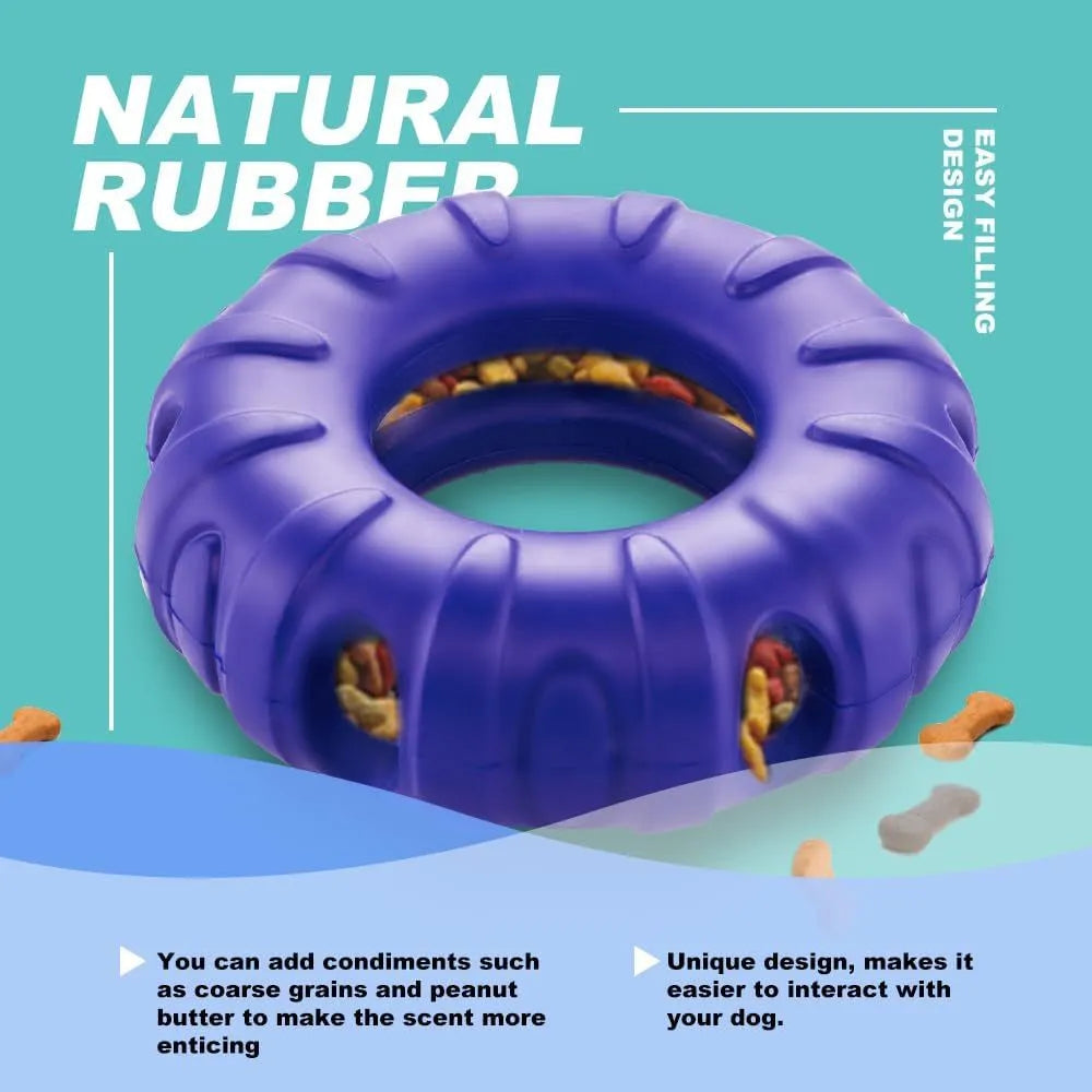 Blue, green, and red natural rubber tyre-shaped dog chew toy with oval openings for treat dispensing.