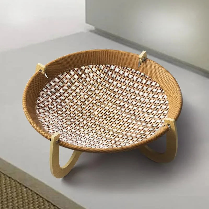 Brown woven rattan square pet hammock bed elevated off the ground.
